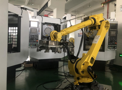 Robot machining center loading and unloading system